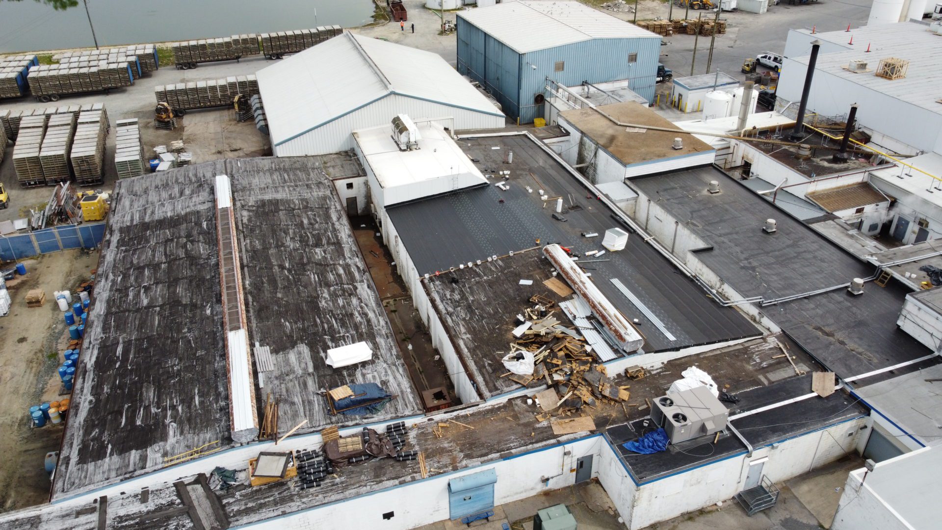Aerial view of a commercial building by Above All Construction
