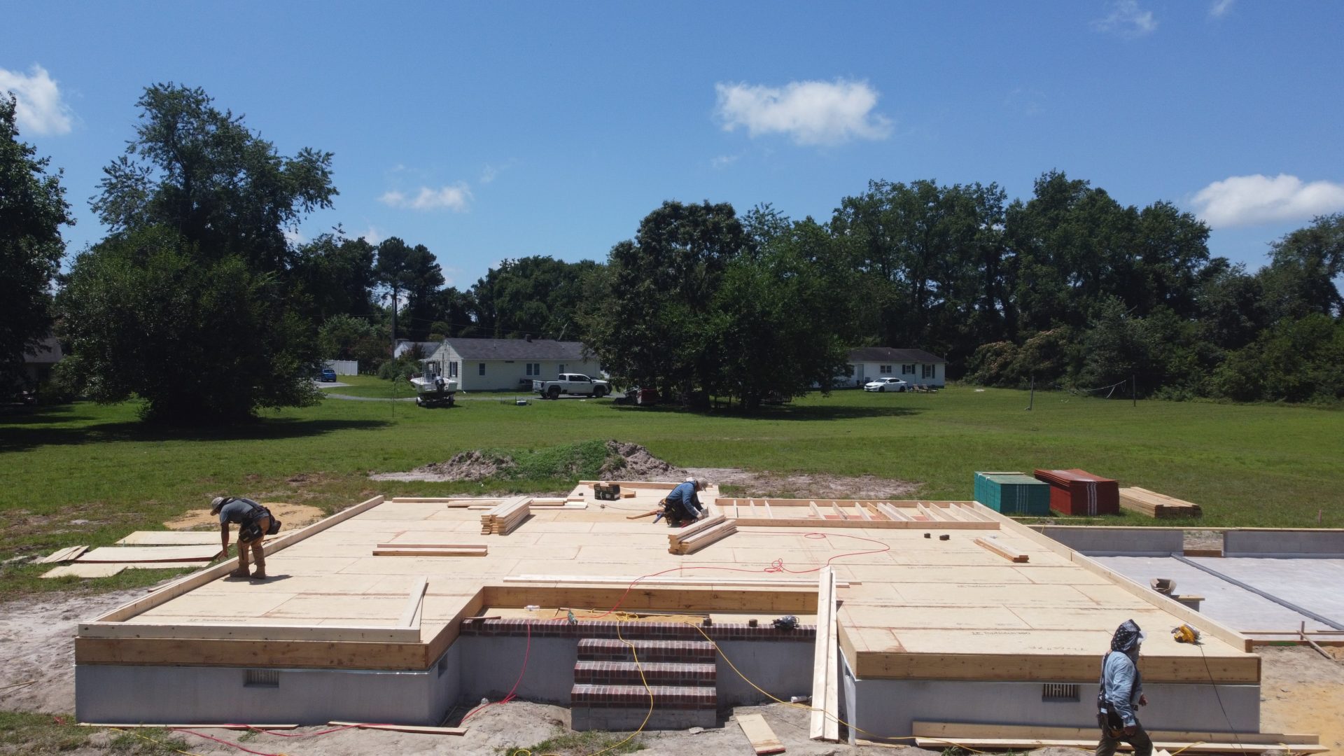 Construction workers framing a custom home in Pocomoke City, MD