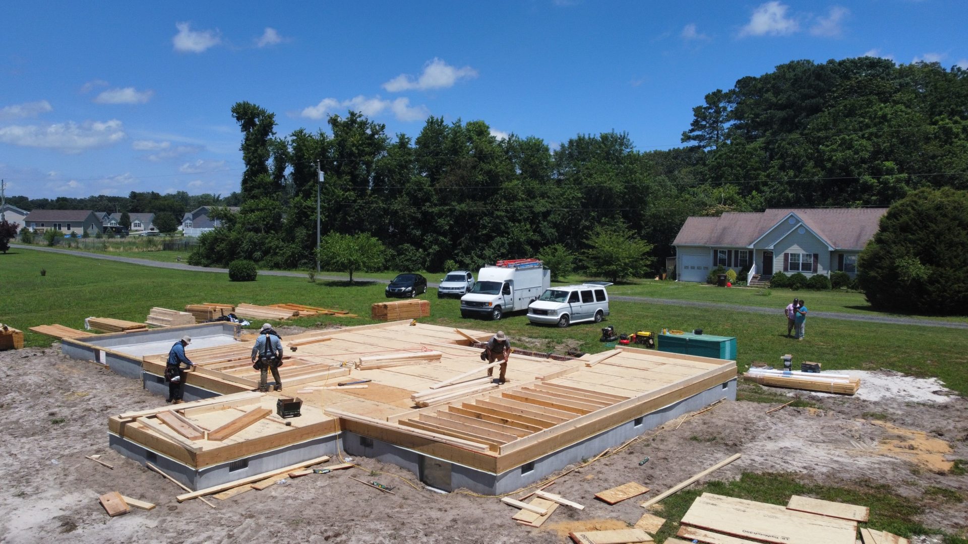 Construction workers framing a custom home in Pocomoke City, MD