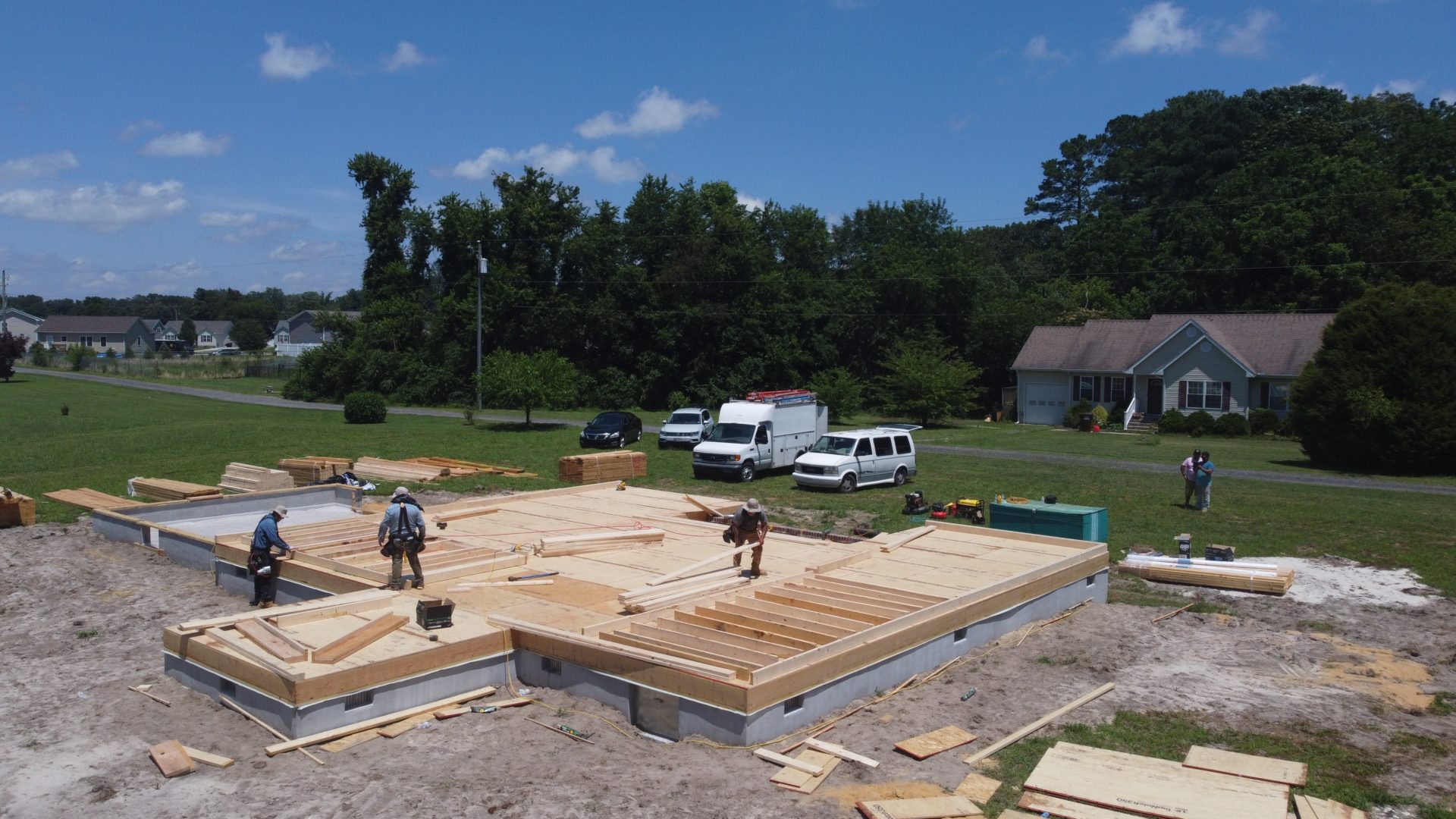 Construction workers during the early phases of building a custom home in Pocomoke City, MD
